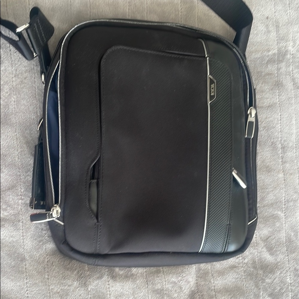 Tumi Black Messenger Bag with Structured Design and Business-Casual Appeal